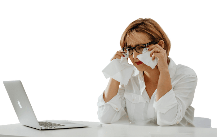 Woman with dry eye from looking at a computer screen all day